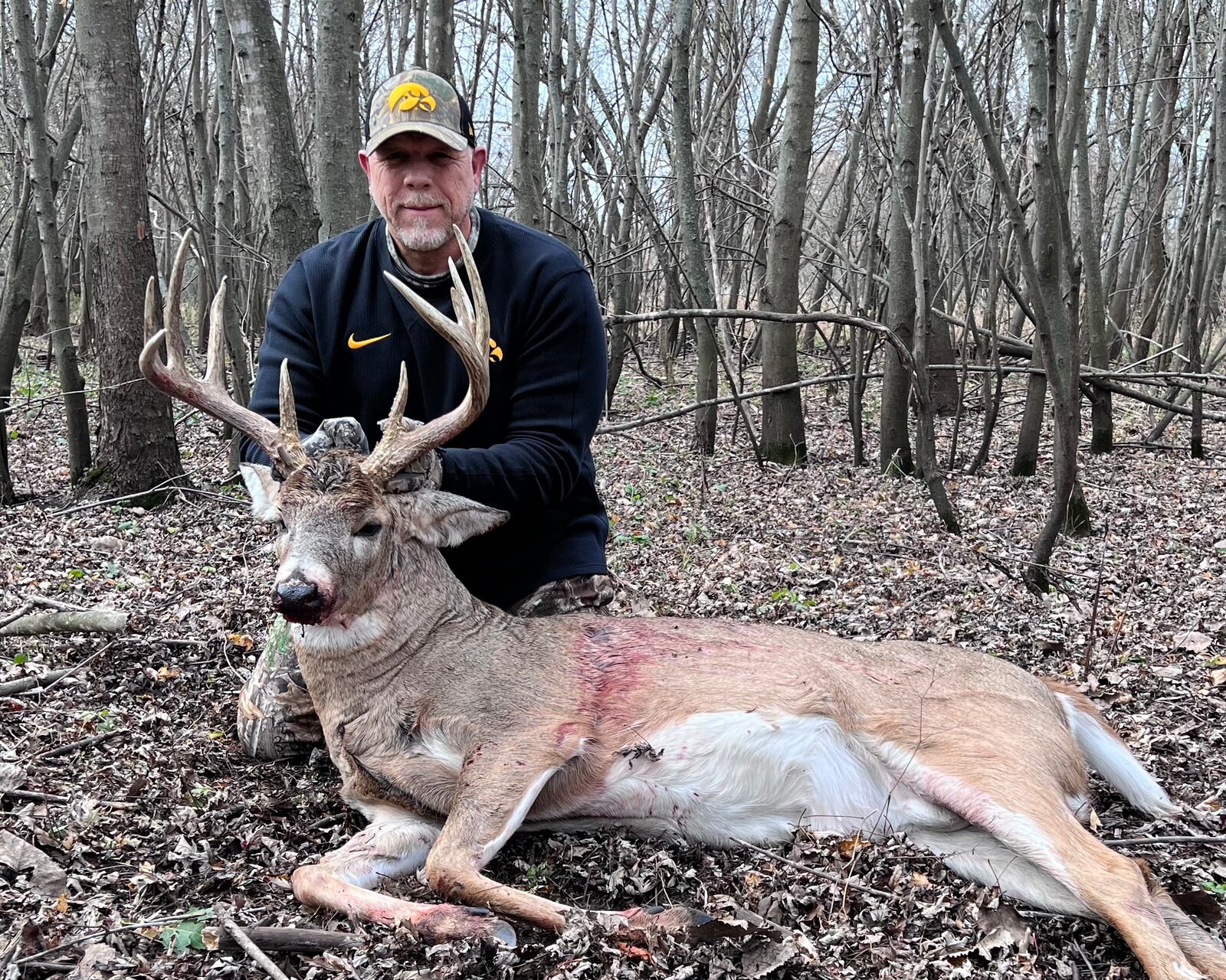 Hunter with whitetail buck harvest